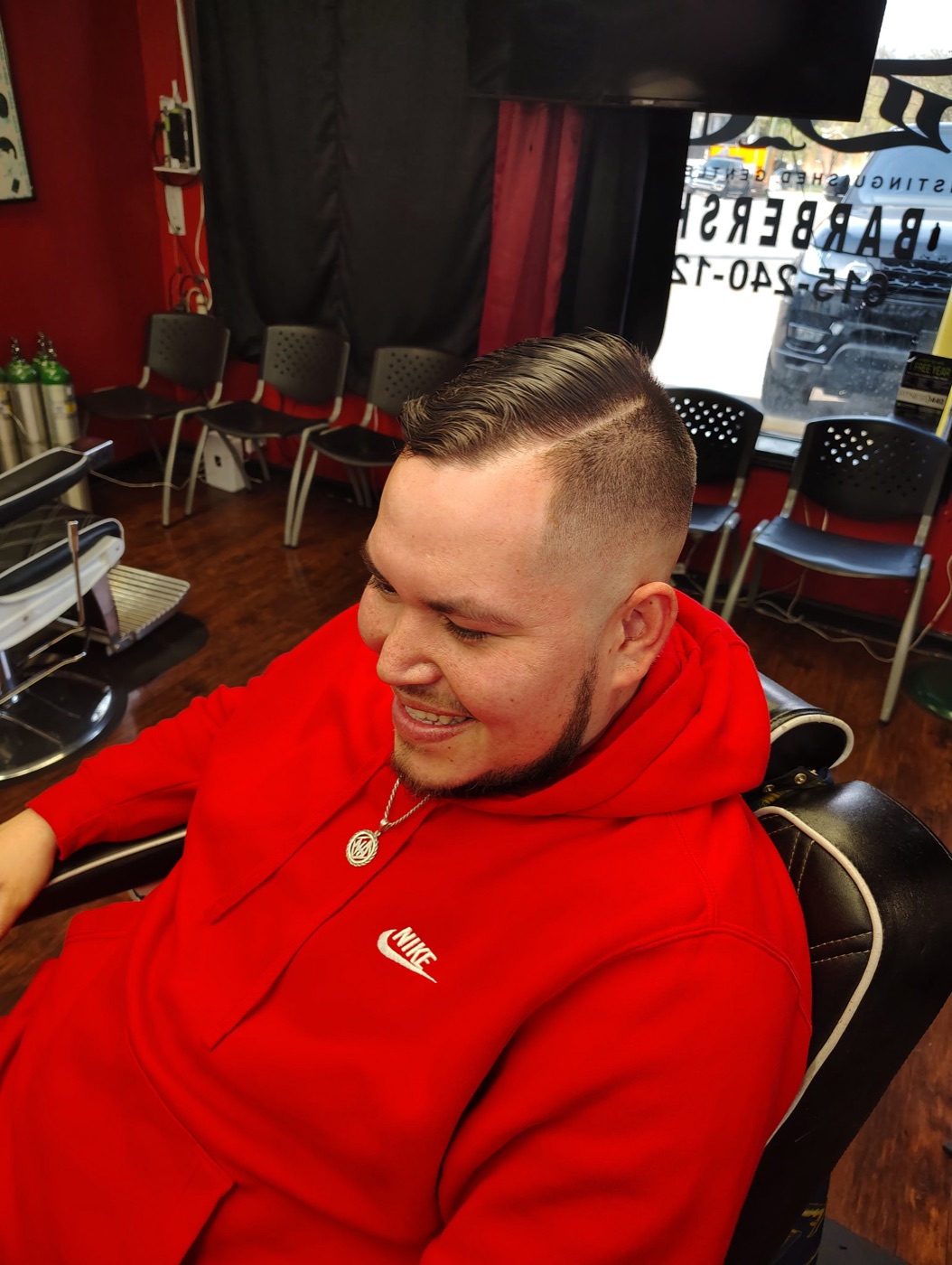 Classic comb-over with a clean burst fade